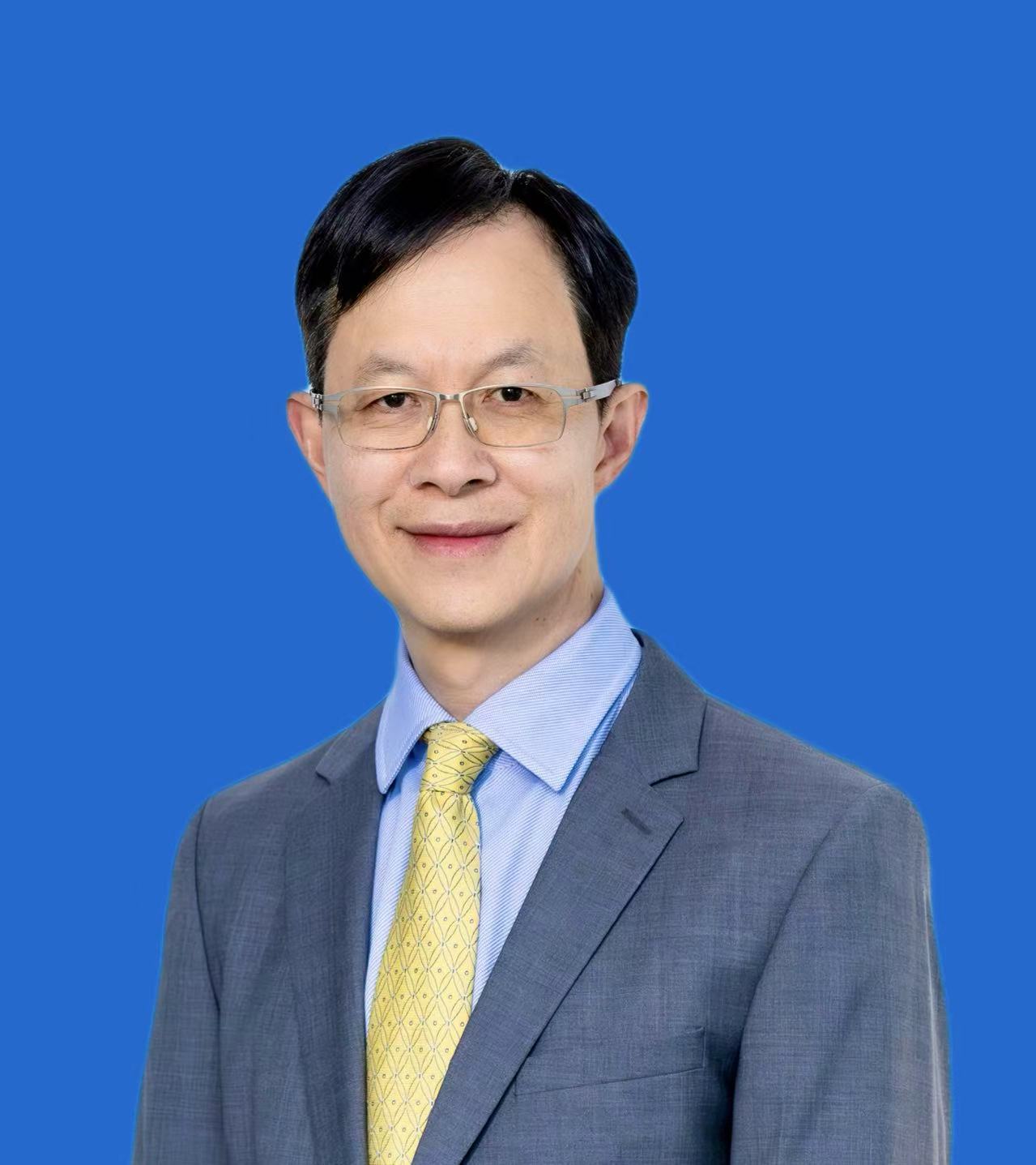 Jack Ng portrait on blue background